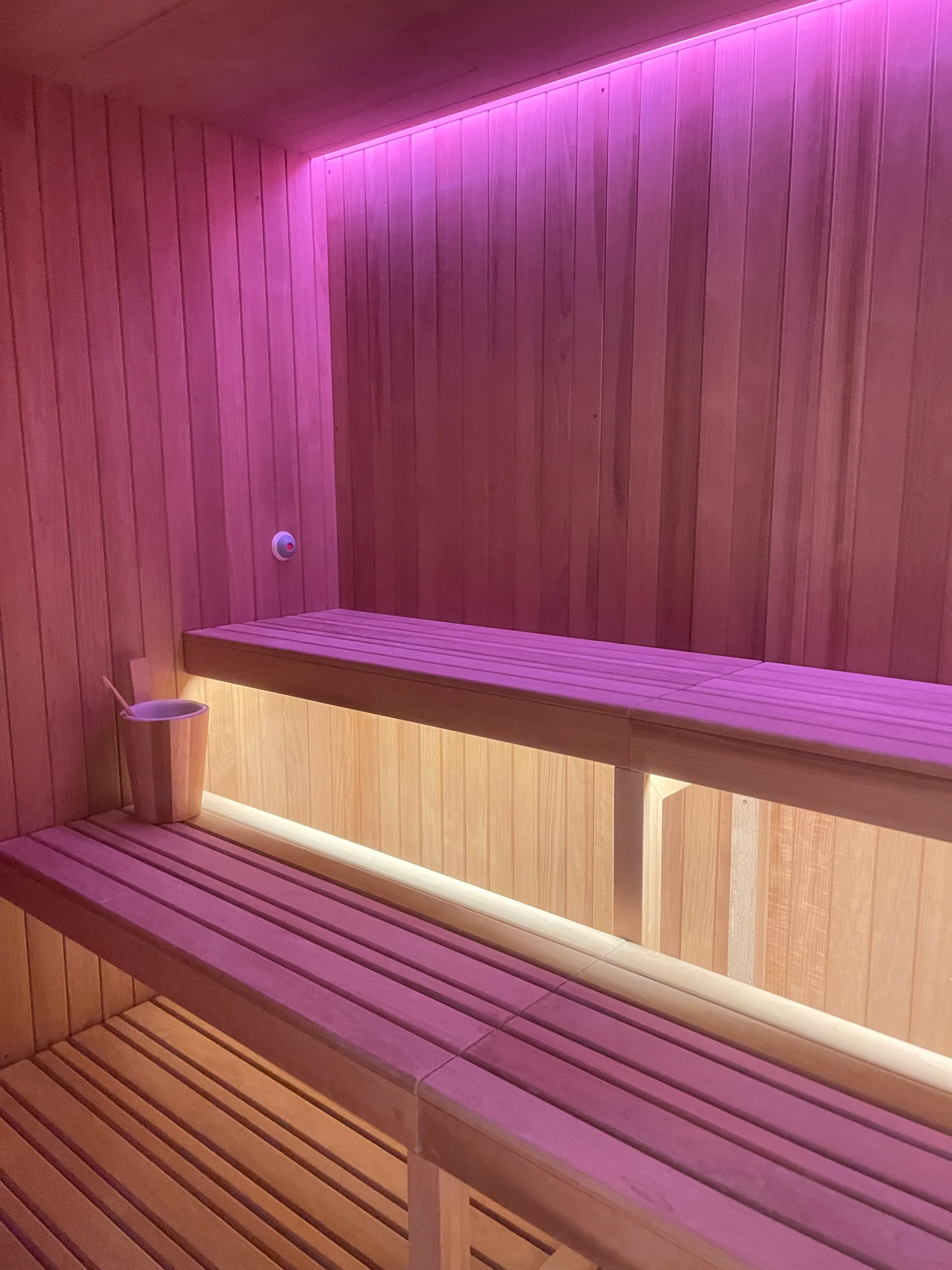 Timber-lined sauna with soft ambient lighting