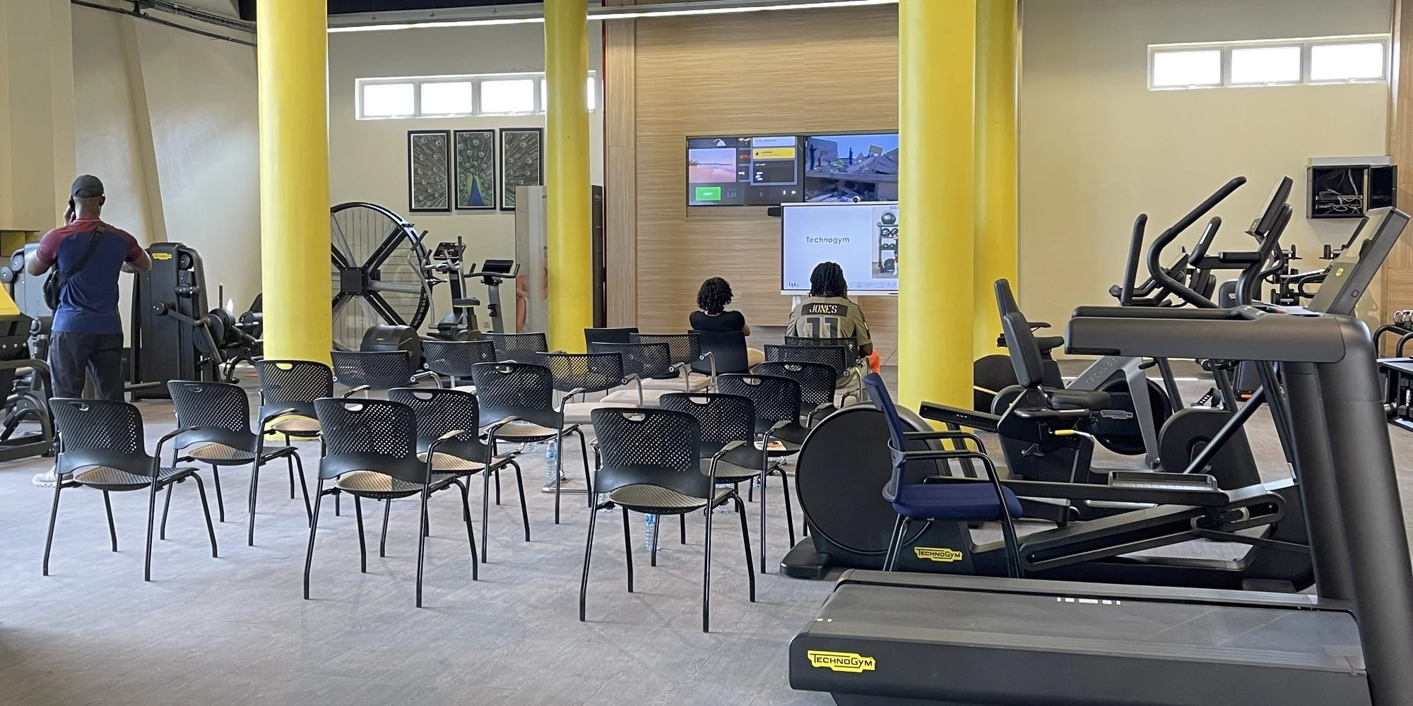 Technogym cardio and strength equipment on a training floor in Lagos